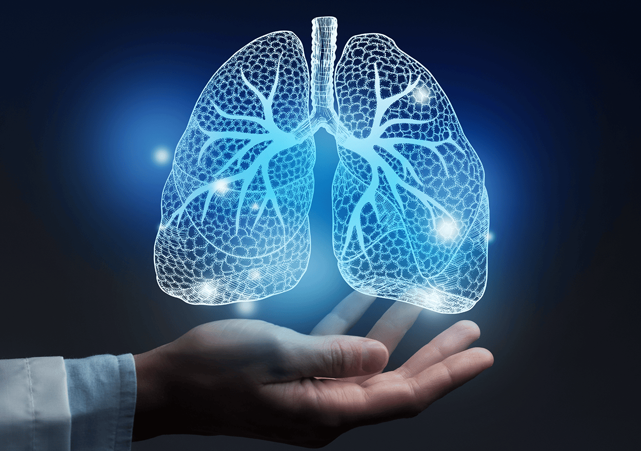 glowing line illustration of human lungs hovering above a persons palm.