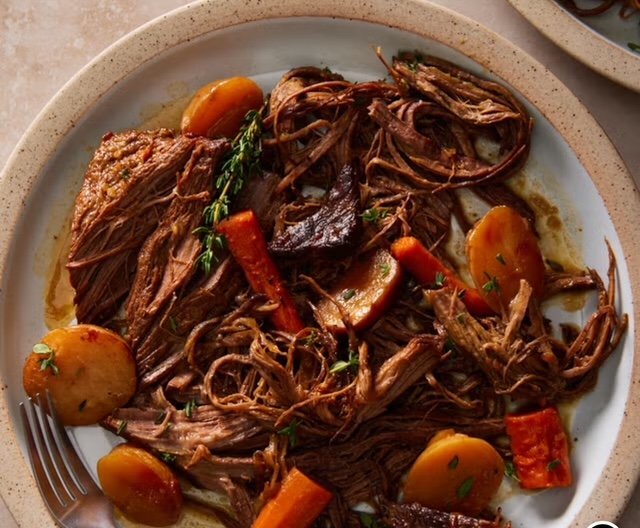 A dish or brisket and vegetables.