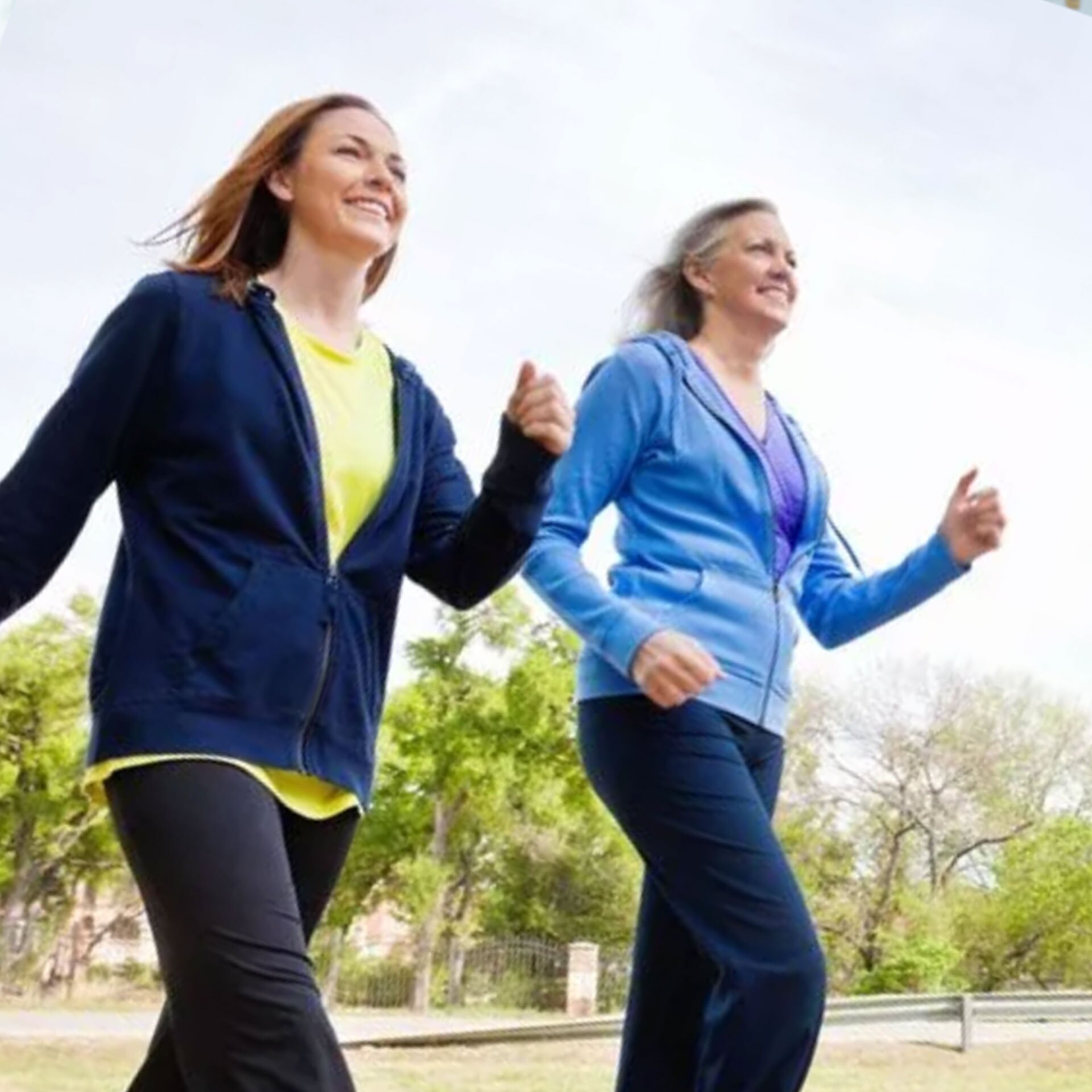 Two women walking outside.