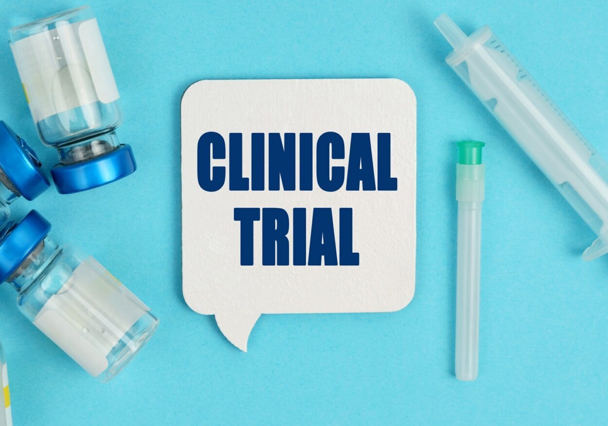 graphic concept showing vials and syringes and the words "Clinical Trial."