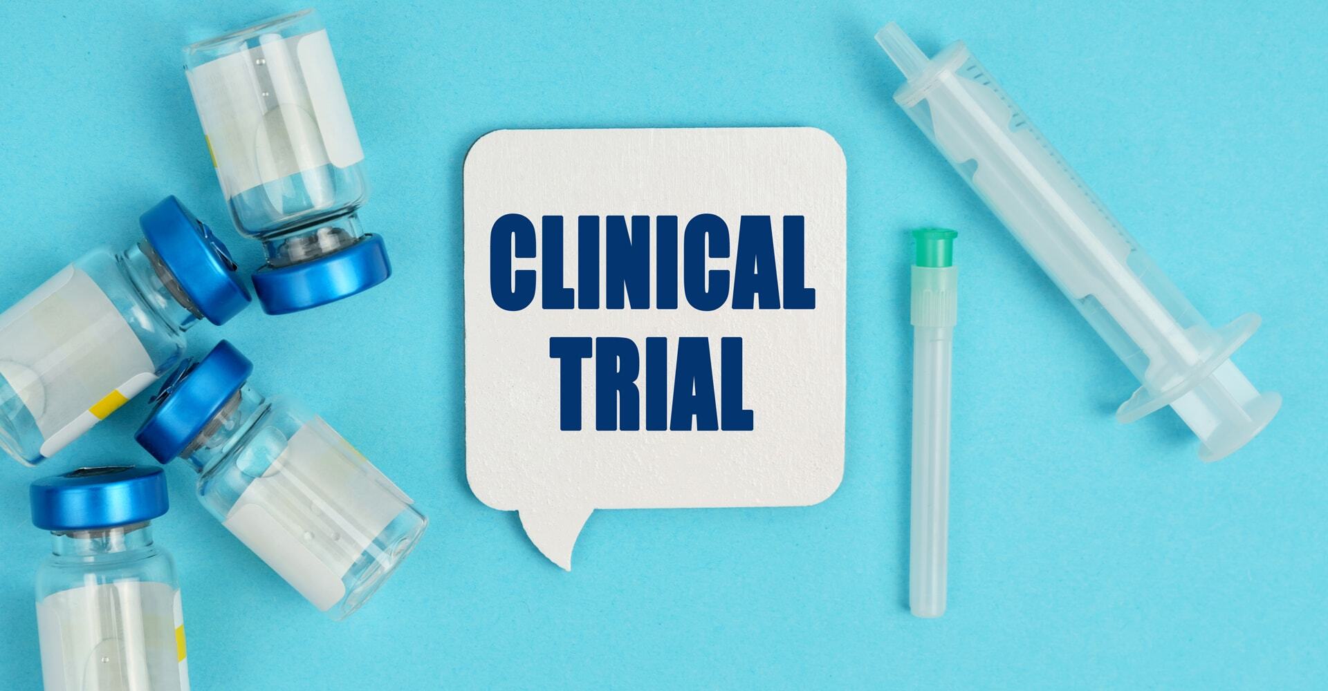 graphic concept showing vials and syringes and the words "Clinical Trial."