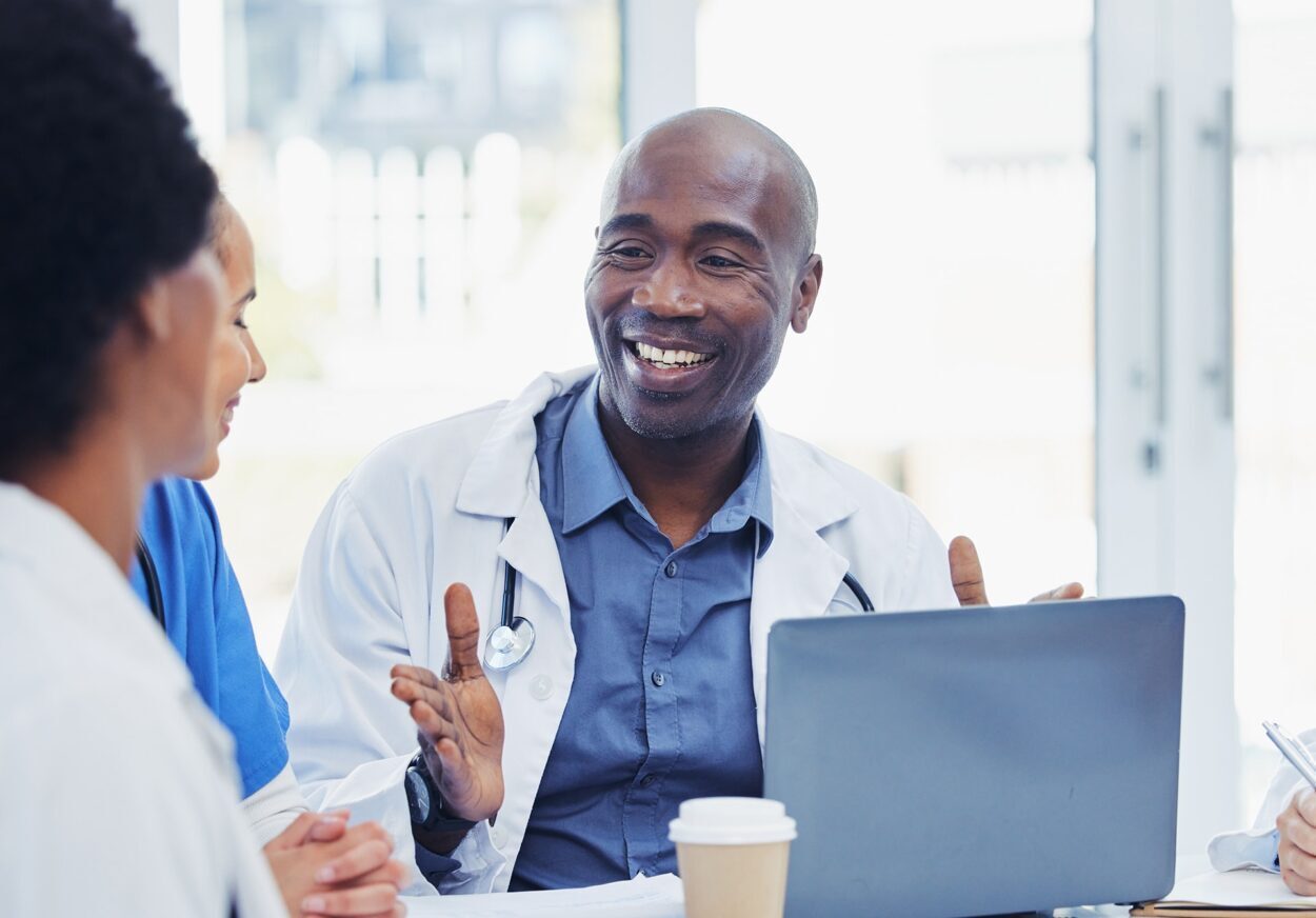 Male medical professional speaking to committee members.